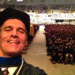 Selfie of Joe Gow infront of commencement audience.