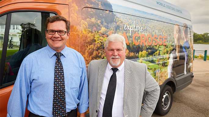From left, La Crosse Mayor Tim Kabat, ’88, and Onalaska Mayor Joe Chilsen, ’86, led the collaborative, county-wide push that created the La Crosse County Convention and Visitors Bureau. Here Chilsen and Kabat stand in front of the new Explore La Crosse Mobile Tourism van, one of the tools used for county-wide tourism. 
Read more →

