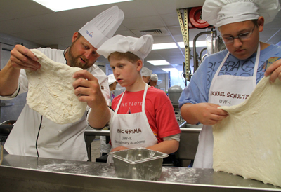 Robb Hanson, a chef at UW-L Whitney Center, pictured with Isaac Grimm, 11, and Michael Schultz, 13,