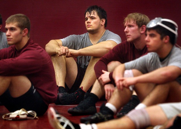 Laurent UW-L 285 pound wrestler Dan Laurent, center, is good on the mat and in the lab.