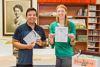 UWL student researcher Cristian Noriega, a psychology major, helped bridge the gap between a local resident with a historic collection and UWL’s Special Collections. Here Noriega, left, is pictured with the collection of “The Leaping La Crosse News” with Laura Godden, Special Collections historian. 