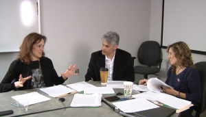 Image of several faculty members sitting together at a table and collaborating on lesson study. 