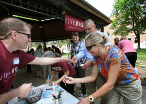 Image of Brad Quarberg helping people register at LIVEMAROON event. 