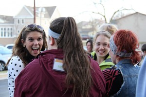 Four students smiling, talking during educational training.