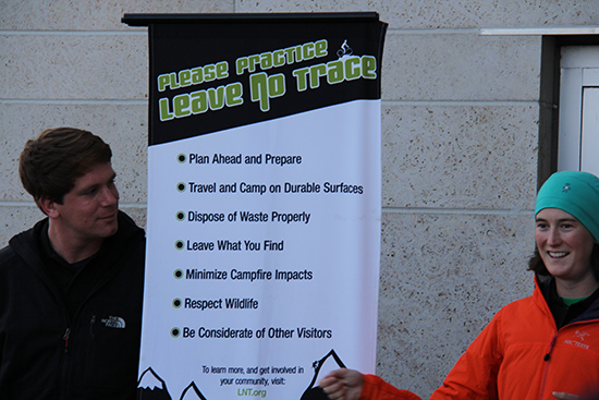 LNT trainers pictured with poster outlining the seven principles of the organization.