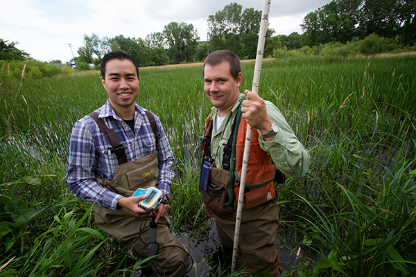 Image of Michael Fuerte with a USGS employee. 
