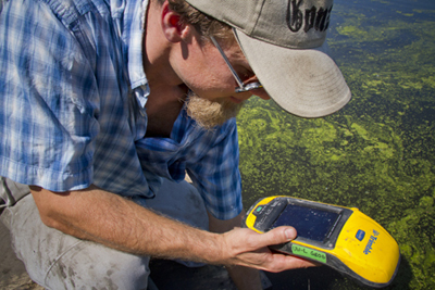Earth Sciences Department Ryan Perroy, UW-L assistant professor of geography, uses his GPS