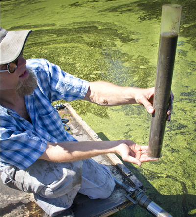 Earth Sciences Department Ryan Perroy, UW-L geography professor, holds a core filled with soil that he and fellow researchers will later test for lead..