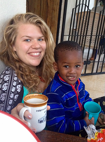 Anna Monson pictured sitting with her host brother. 