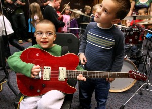 Emerson kindergarteners enjoy learning about music with UW-L Jazz Ensemble II. Photo-La Crosse Tribune.