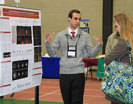 Student pictured at poster session during the National Conference on Undergraduate Research.