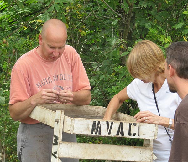 image of teachers looking at artifacts in the outdoors during the  2012 Humanities Summer Institute for Teachers.