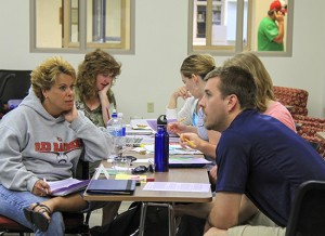 A group of pre-K-12 teachers discuss education standards during a workshop at UW-L's new Collaborative Learning Center. 