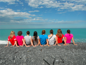 UW-L students pictured from behind looking out onto a body of water.