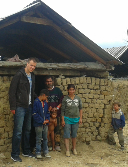 Some of the family members in the Romanian ghetto pictured in front of their old house.