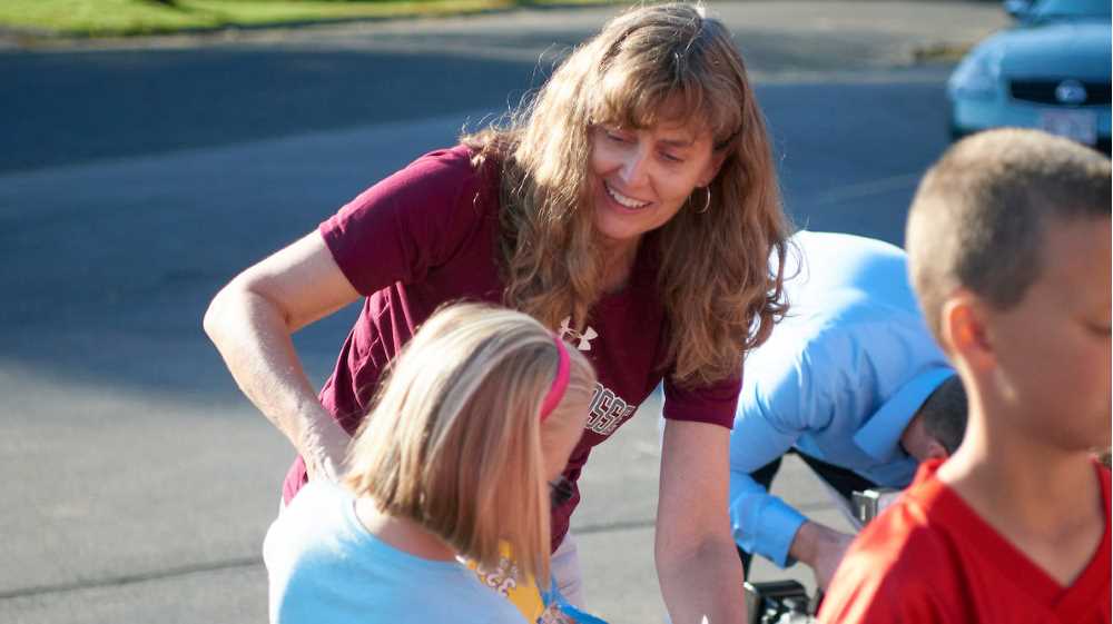 Mathematics Professor Susan Kelly helps unload donated school supplies with students at Coon Valley Elementary School.
Read more →
