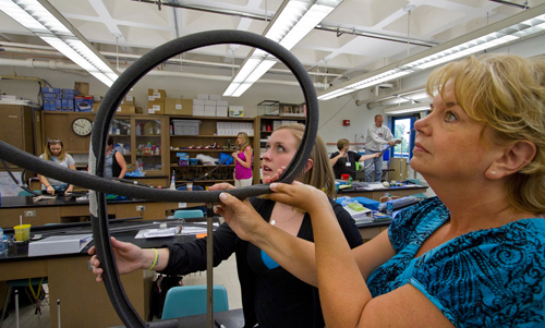 Physics__Workshop_1 Teachers in grades 3-10 construct mini rollercoasters in a UW-L science lab with help from university faculty.