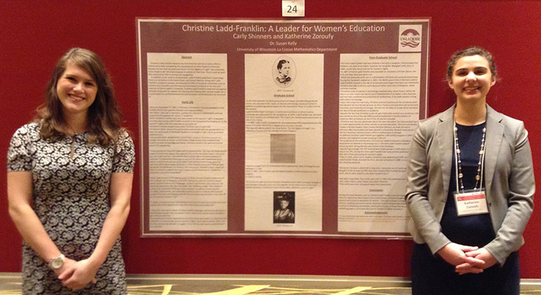 Students in front of poster.
