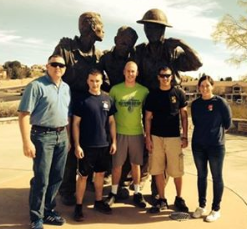 Four ROTC members and battlion cammander pose.