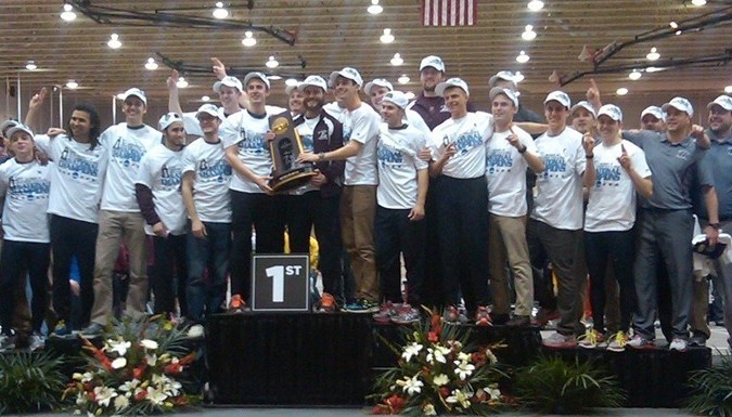 Group shot of team with trophy. 