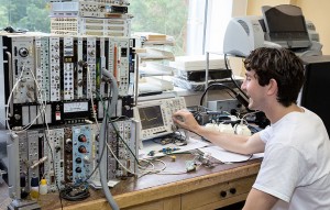 Student with computer equipment.