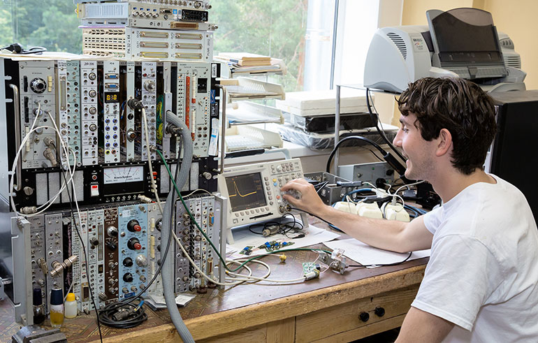 Student with computer equipment. 