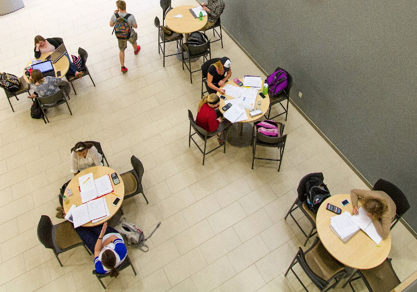 Image of students studying at tables in Centennial Hall. 