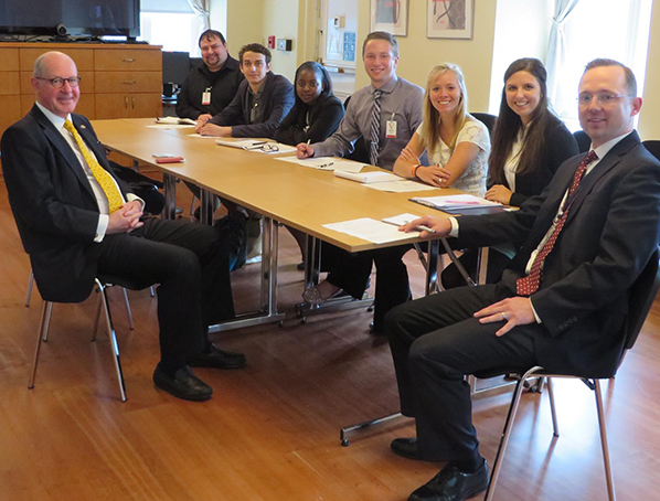 Image of students sitting around a table with the Ambassador to Slovakia. 