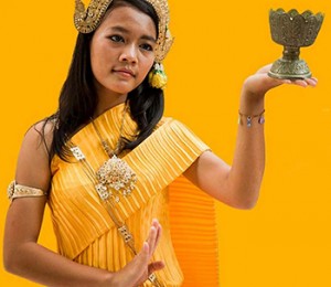 Girl with chalice in traditional clothing.