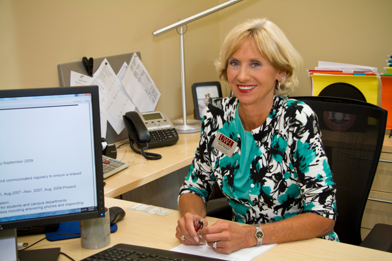 Photo of Karla Stanek in office. 