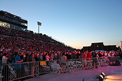 Image of crowd sitting in the bleachers at Veterans Memorial Field Sports Complex. 