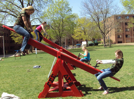 Students teeter-tottering. 