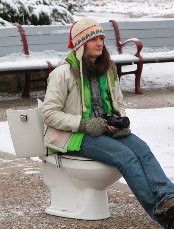 toilet600 Student on toilet outside.