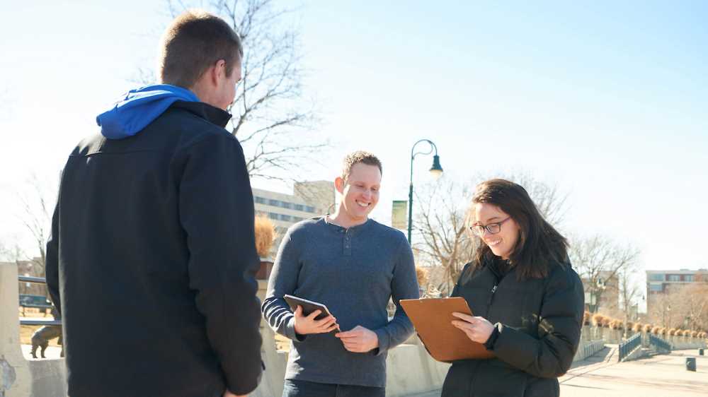 Daniel Plunkett, center, is a UWL assistant professor and the Tourism Research Institute’s director. He is pictured with UWL students who will be involved in research for the institute. 
Read more →