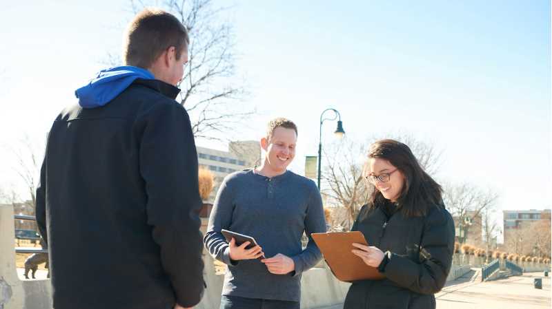 Daniel Plunkett, center, is a UWL assistant professor and the Tourism Research Institute’s director. He is pictured with UWL students who will be involved in research for the institute. 
Read more →
