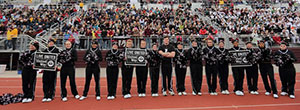 Cheerleaders with Live United signs. 