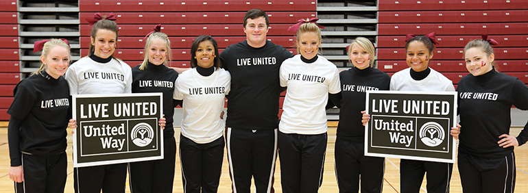 People with United Way T-shirts and signs.
