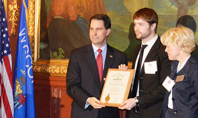 Governor Walker with award and recipients.