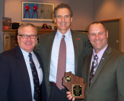 Keith Bakken, Joe Gow and Brian Marx with plaque.