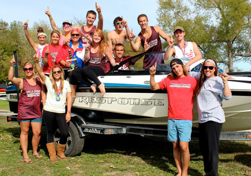WaterSki3 UW-L Water Ski Team pictured in front of a boat.