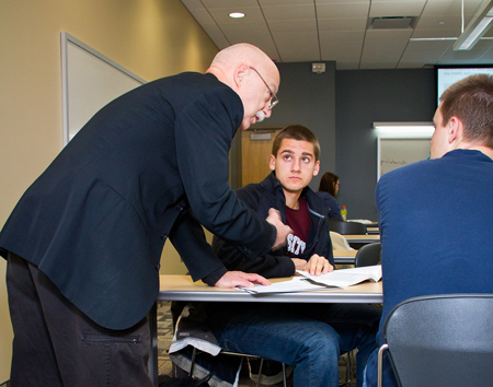 Gregory Wegner, UW-L professor of history, talking with students.
