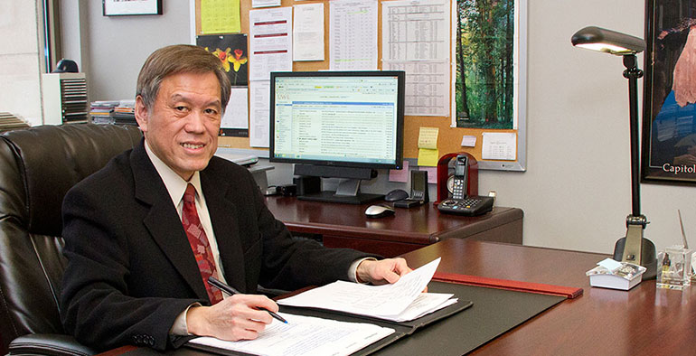 Photo of Wen Kuang Wei in his office. 