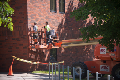 Workers replaced deteriorated bricks and sealed up joints in various spots on Wimberly Hall's exterior.