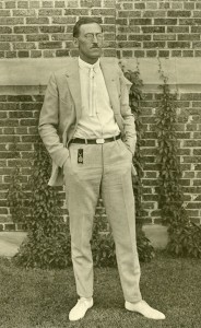 Walter J. Wittich standing in front of a building.