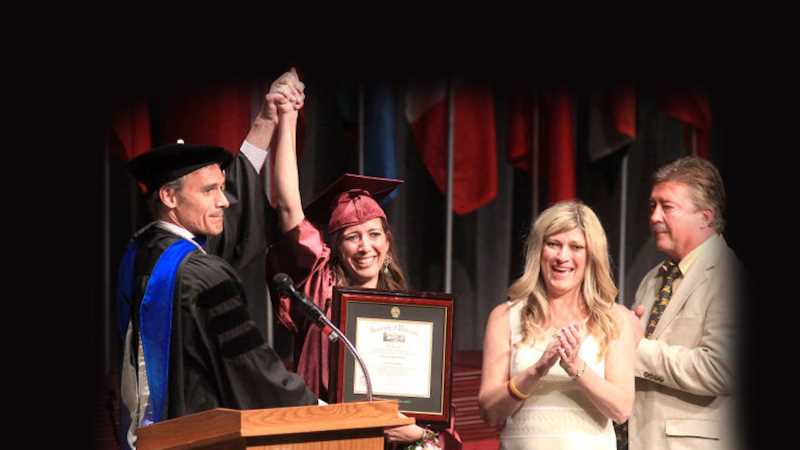 Kimberly Graham with UWL Chancellor Joe Gow during the 2013 graduation ceremony. At the right are her parents, Dawn and Gary.Today her story lives on with a scholarship awarded each year through The Kimberly D. Graham Extraordinary Scholarship Fund.