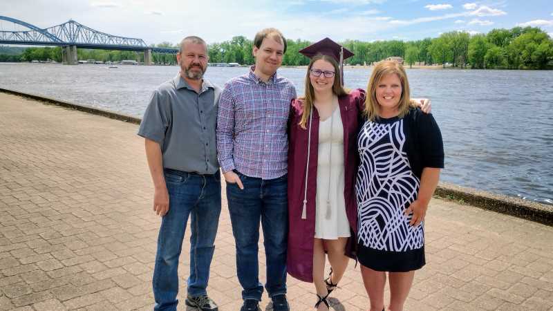 Melanie Korish, an Administrative Assistant II in UWL’s Parking Services, right, with her family, joined the UWL Alumni Association to “give back to the organization that has provided so much for my family.”