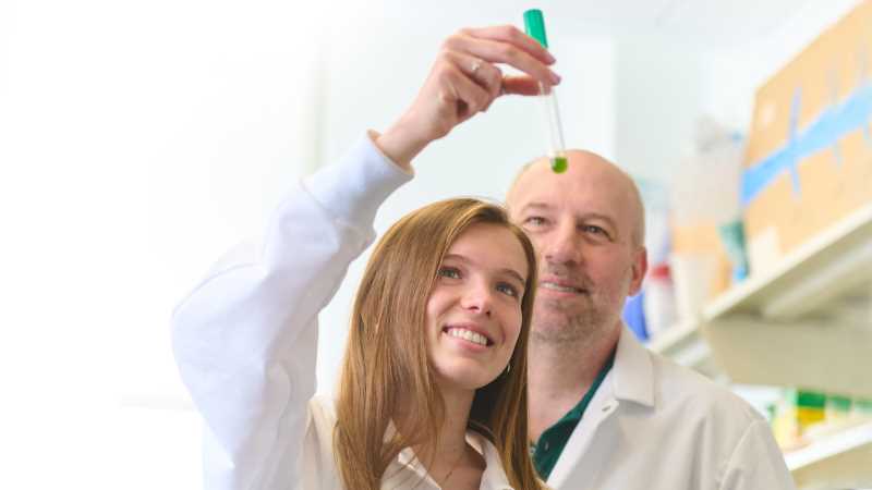 UWL senior Annie Panico with mentor, Anton Sanderfoot, associate professor of Biology. Sanderfoot's lab students conduct experiments with green algae, a one-celled plant. Panico has expanded the research to pursue her environmental interests. She is using green algae to better understand the effects of nitrates in drinking water.