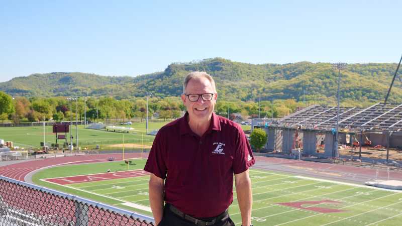 Mark Gibson standing at his favorite spot on campus: in the stadium.