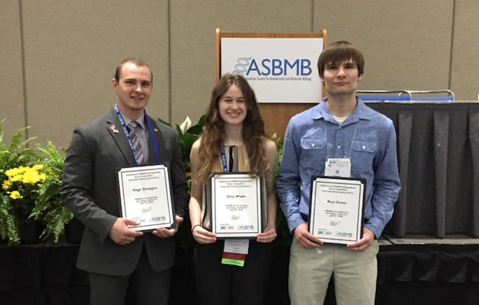 As a UWL undergraduate, Gage Stuttgen received a national award for the presentation of his undergraduate research at the American Society for Biochemistry and Molecular Biology conference. Today he continues to receive recognition for his research. Here he poses in 2018 with fellow students. From left,  Stuttgen, Gina Wade, and Ross Soens.