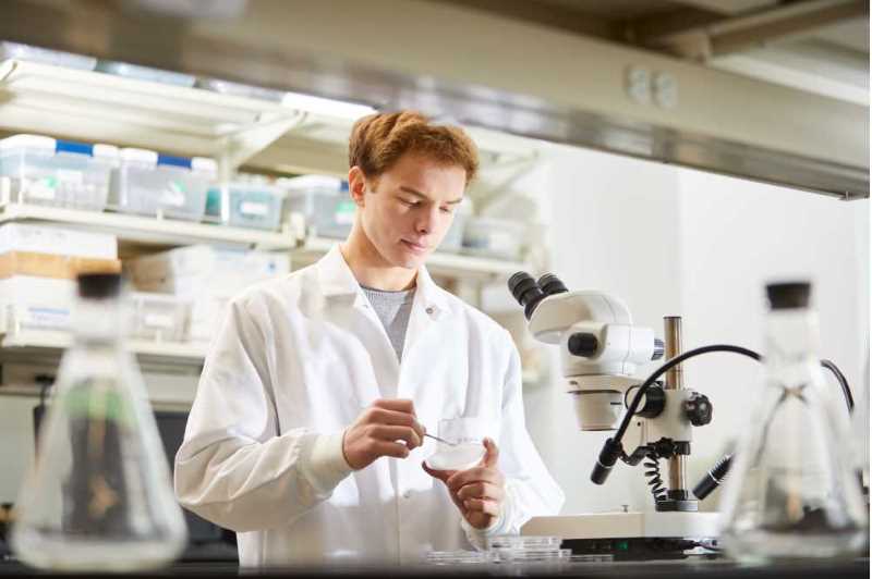 Student works in a science lab on the UWL campus